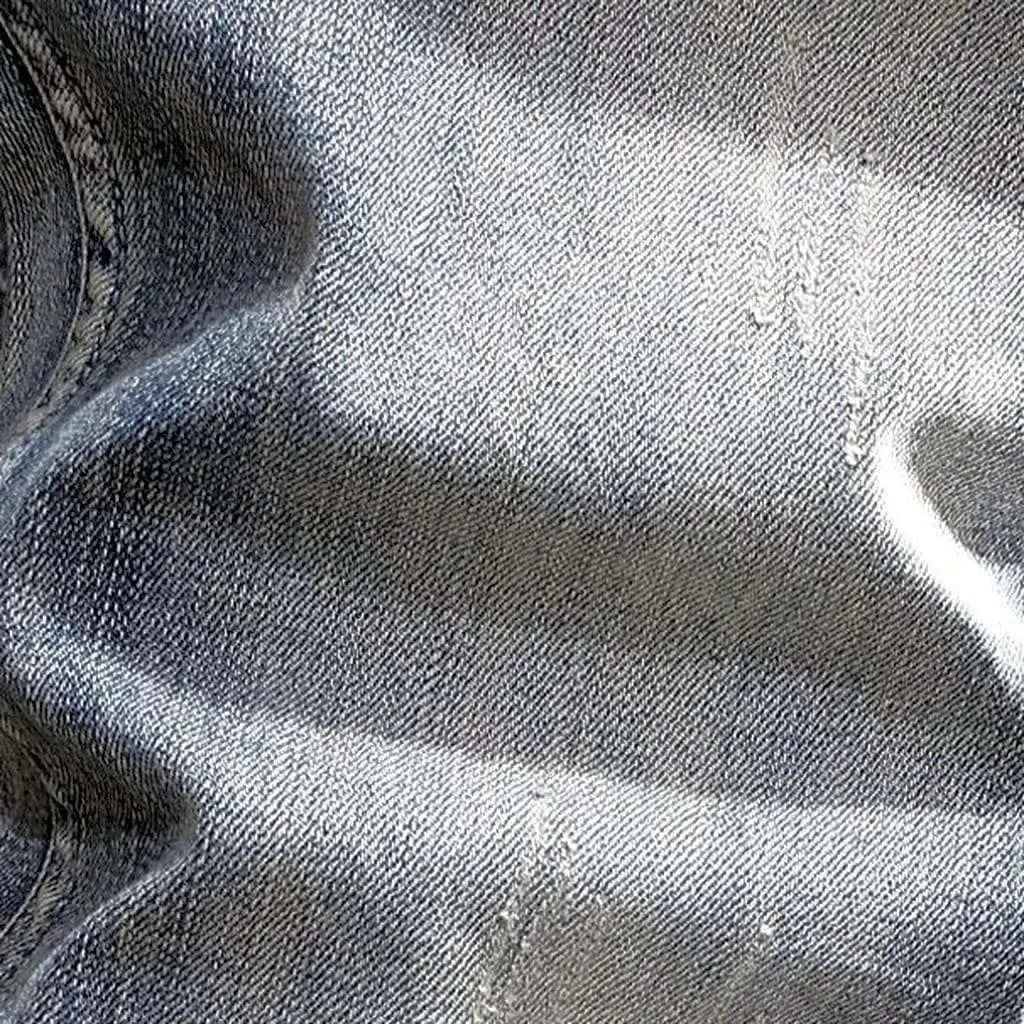 Slightly men's torn jeans