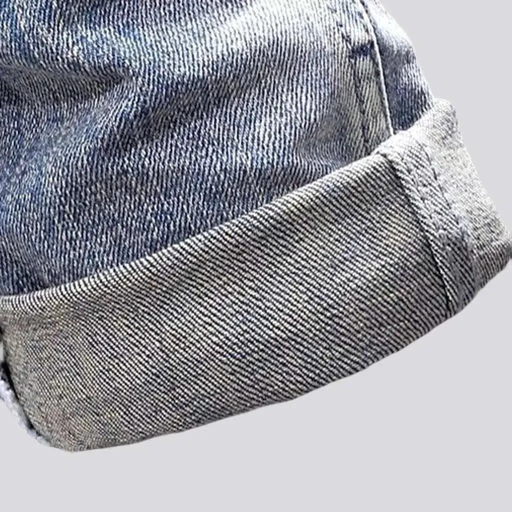 Slightly men's torn jeans