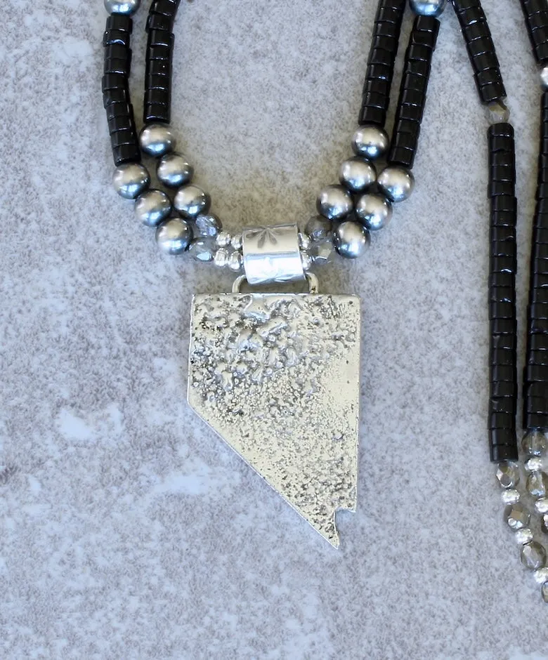 State of Nevada Reticulated Silver Pendant with 2 Strands of Black Onyx Heishi, Oxidized Sterling Silver Rounds, and a Sterling Silver Toggle Clasp